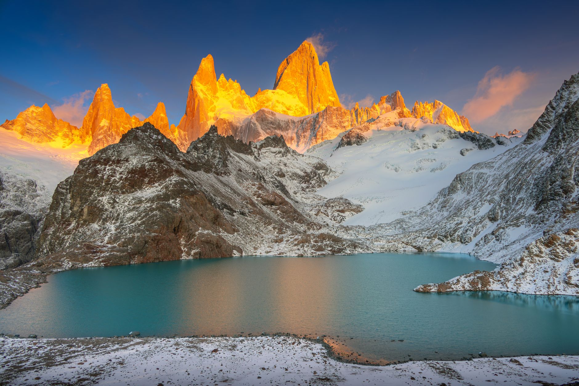 Patagonian granite peaks reflecting in glacial lagoon